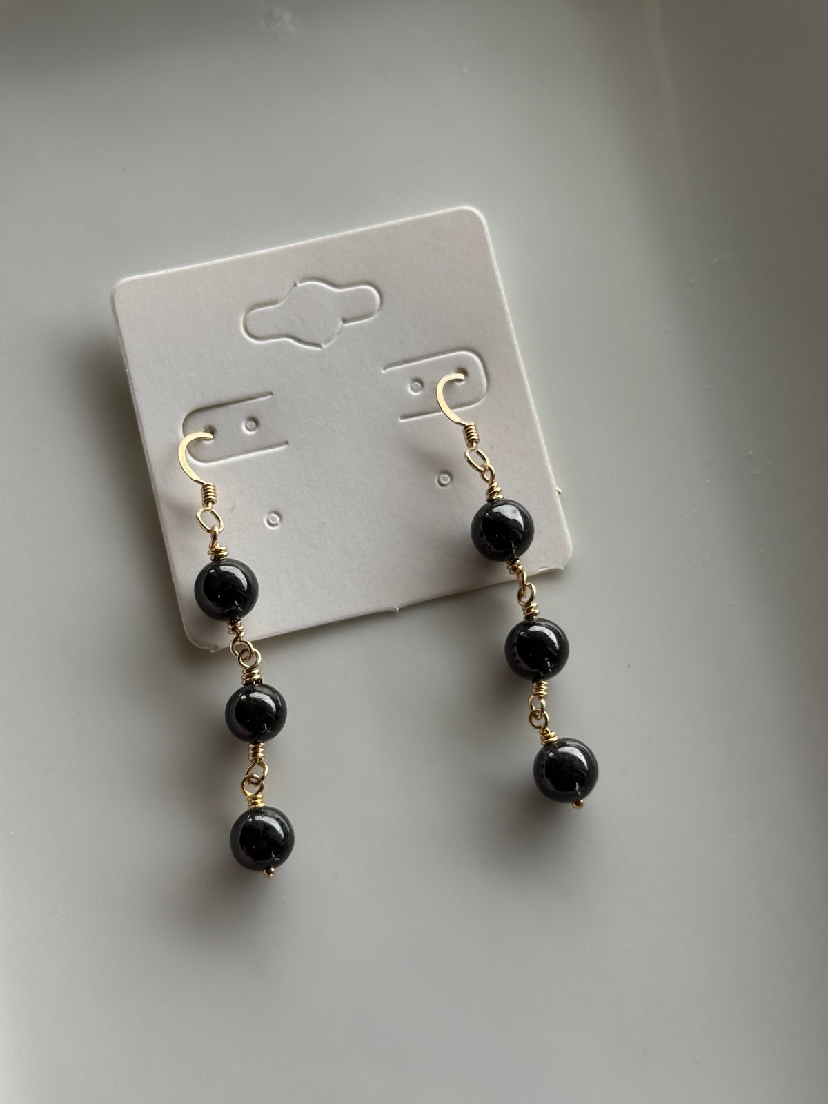ʻEkolu drop jade earrings