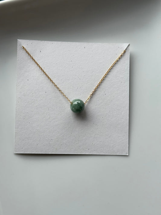 Floating green jade bead necklace