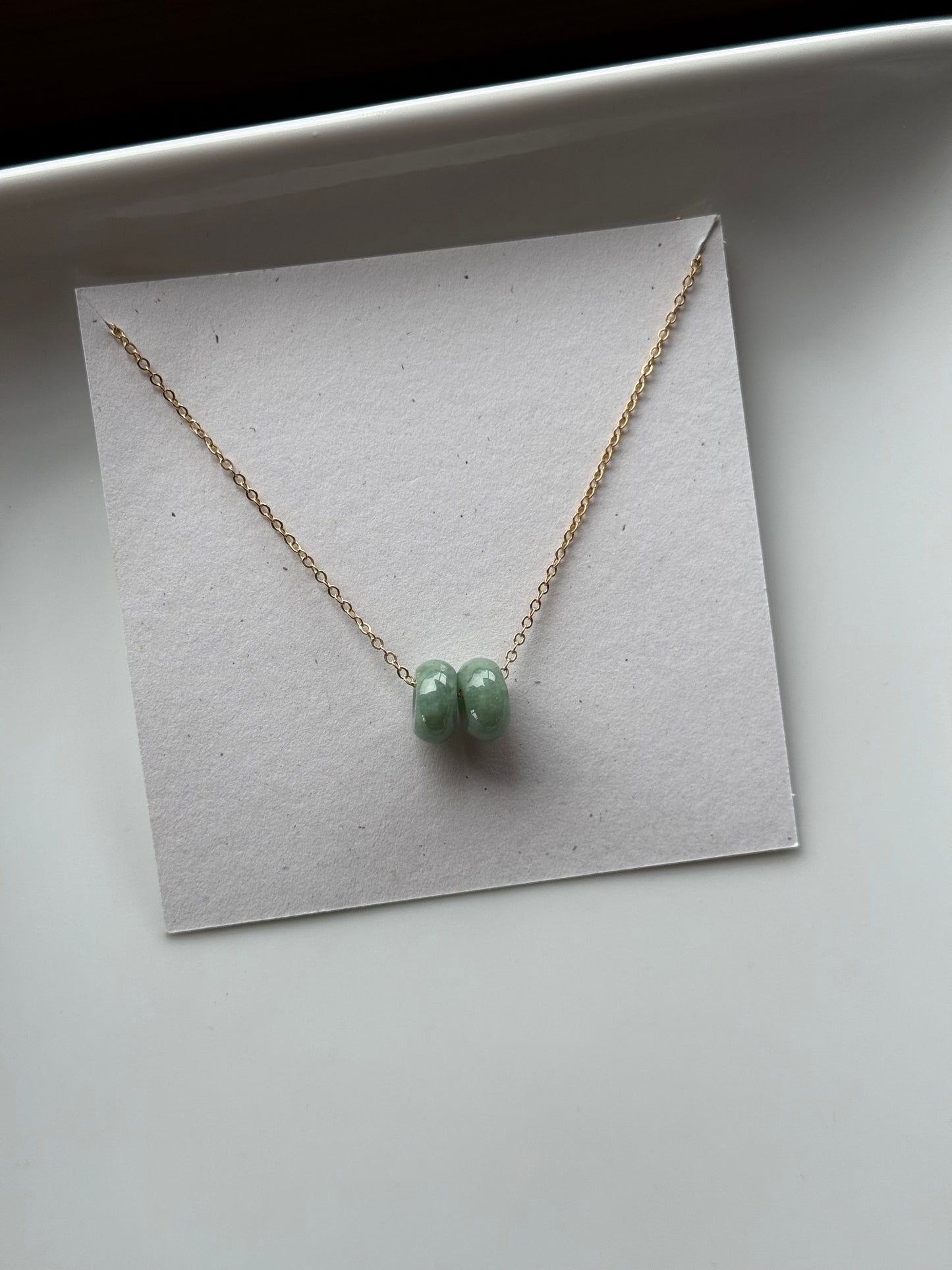 Floating green donut jade necklace