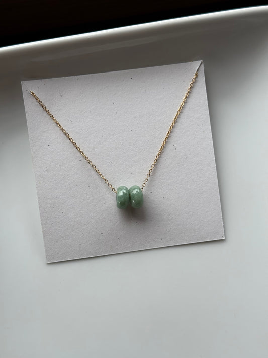 Floating green donut jade necklace