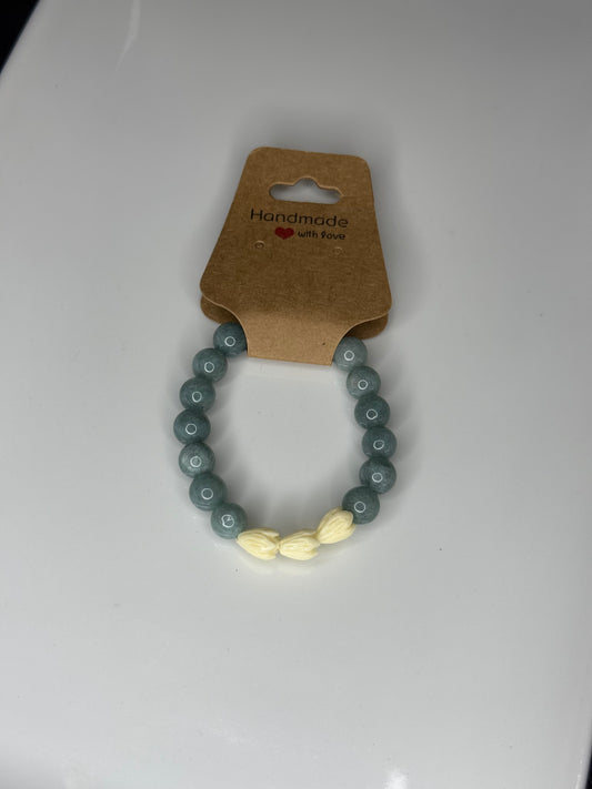 Stretchy beaded pikake/jade bracelet